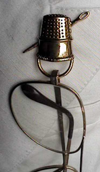 Thimble SpecKeeper with glasses attached><BR><CLEAR=ALL>
<FONT face=